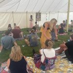 A breathwork session at a festival