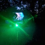 Lady DJing at a silent disco event in the woods at Redricks Lake