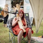 lady playing harp at yoga wild festival