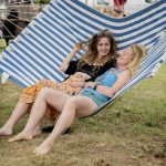 2 ladies in hammock at yoga wild festival
