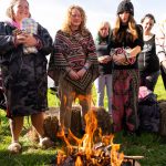 Women around a sacred fire at retreat with the Conscious Heart Warriors