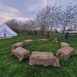 Bell tent with a circle of hay bales