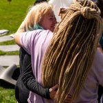 Ladies hugging at a Conscious Heart Warriors deep healing retreat