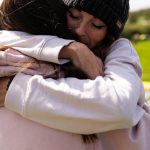 Two ladies hugging at a deep healing retreat with the Conscious Heart Warriorsetreat