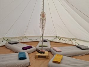 Communal sleeping bell tent in the Conscious Heart Warriors healing village