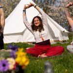 Lady doing yoga in nature at deep healing retreat with the Conscious Heart Warrior's