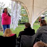 Mediumship demonstration with Kerry Standfast at the Conscious Heart Warrior's healing village for festivals.