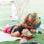 lady healing someone at breathwork ceremony