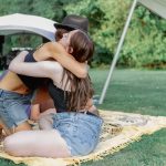 lady hugging girl at ceremony